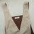 Beige apron with brown interior on a light gray background